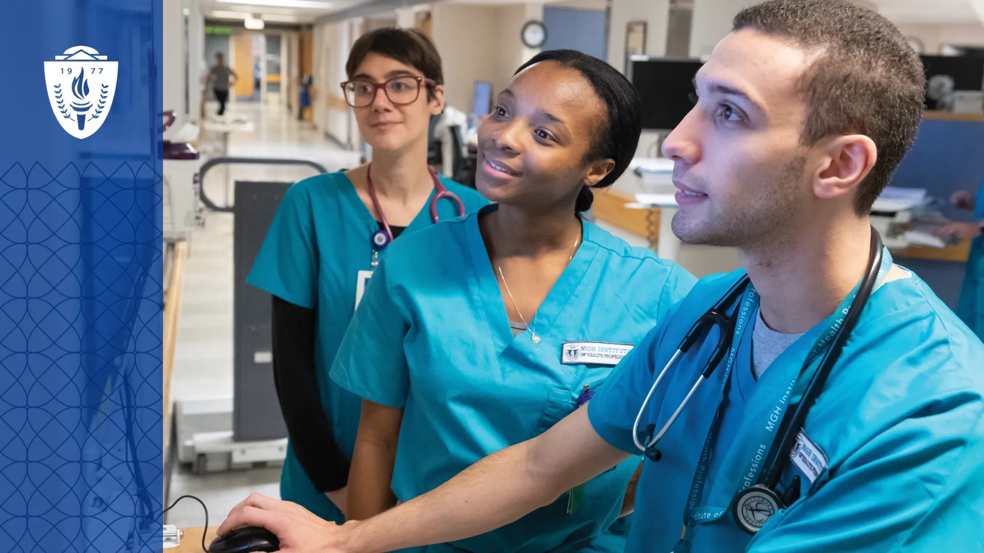 Healthcare Workers wearing scrubs and stethoscopes looking at computer screen