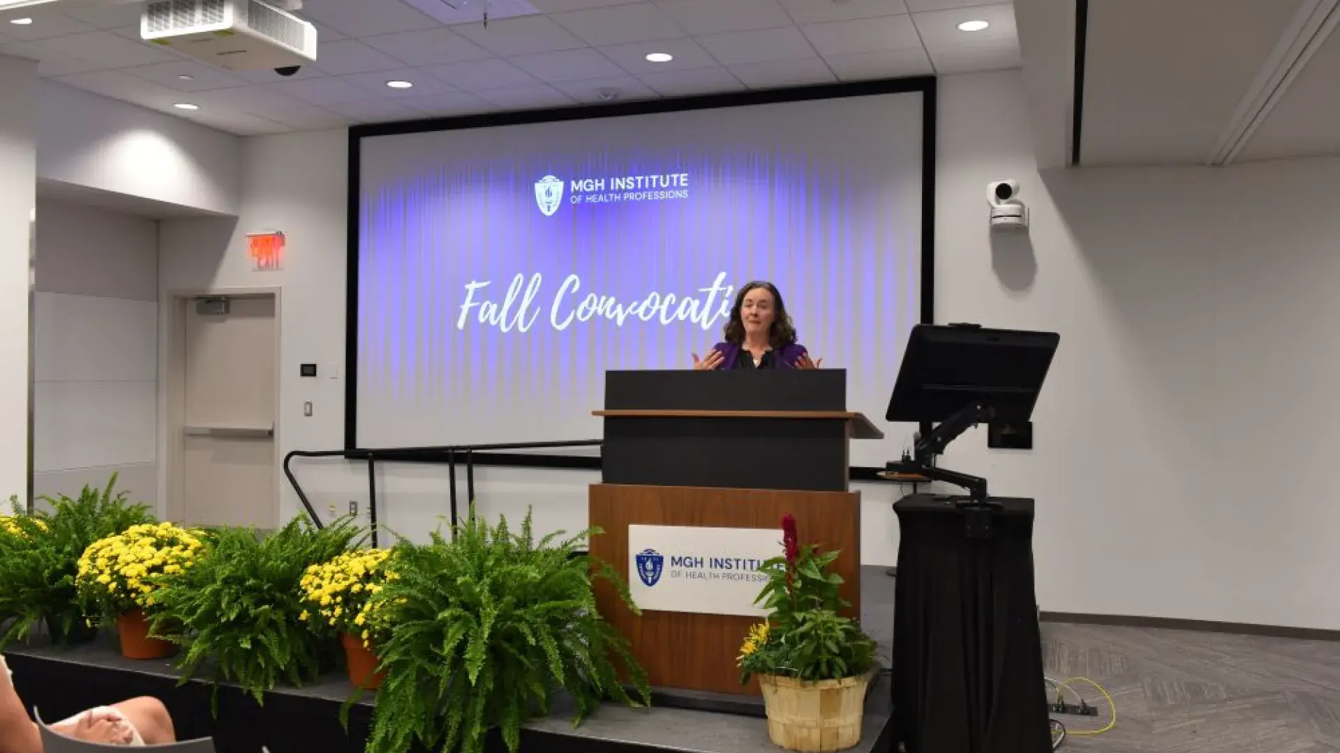 Woman standing at a podium