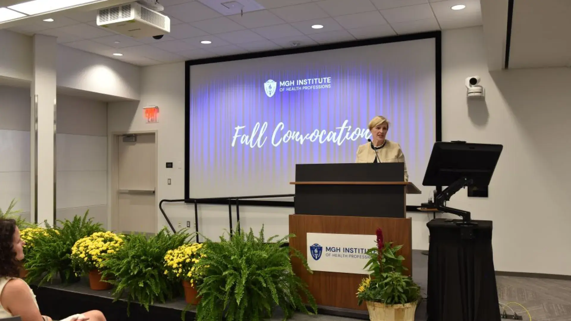 Woman standing at a podium