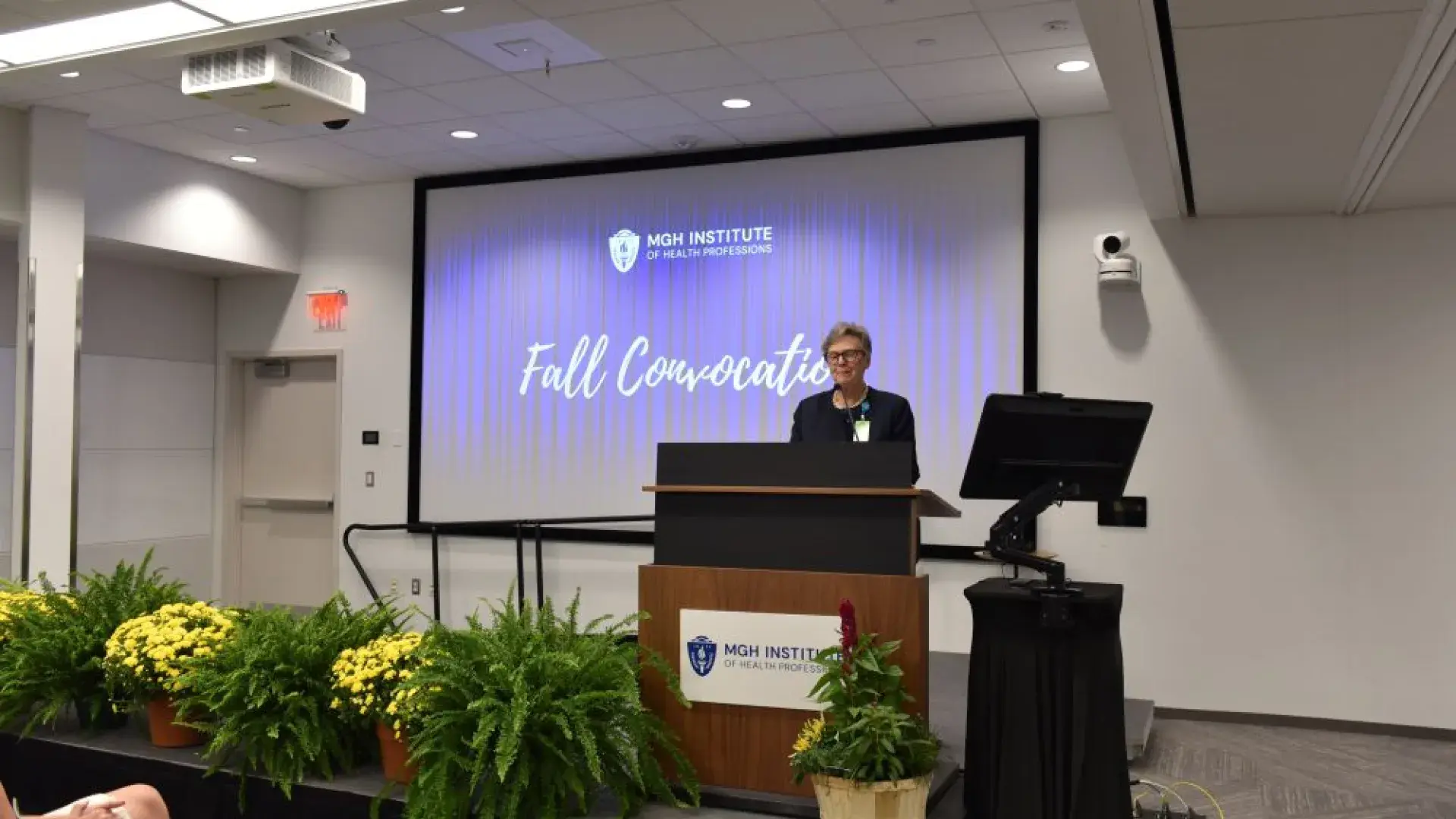 Woman standing at a podium