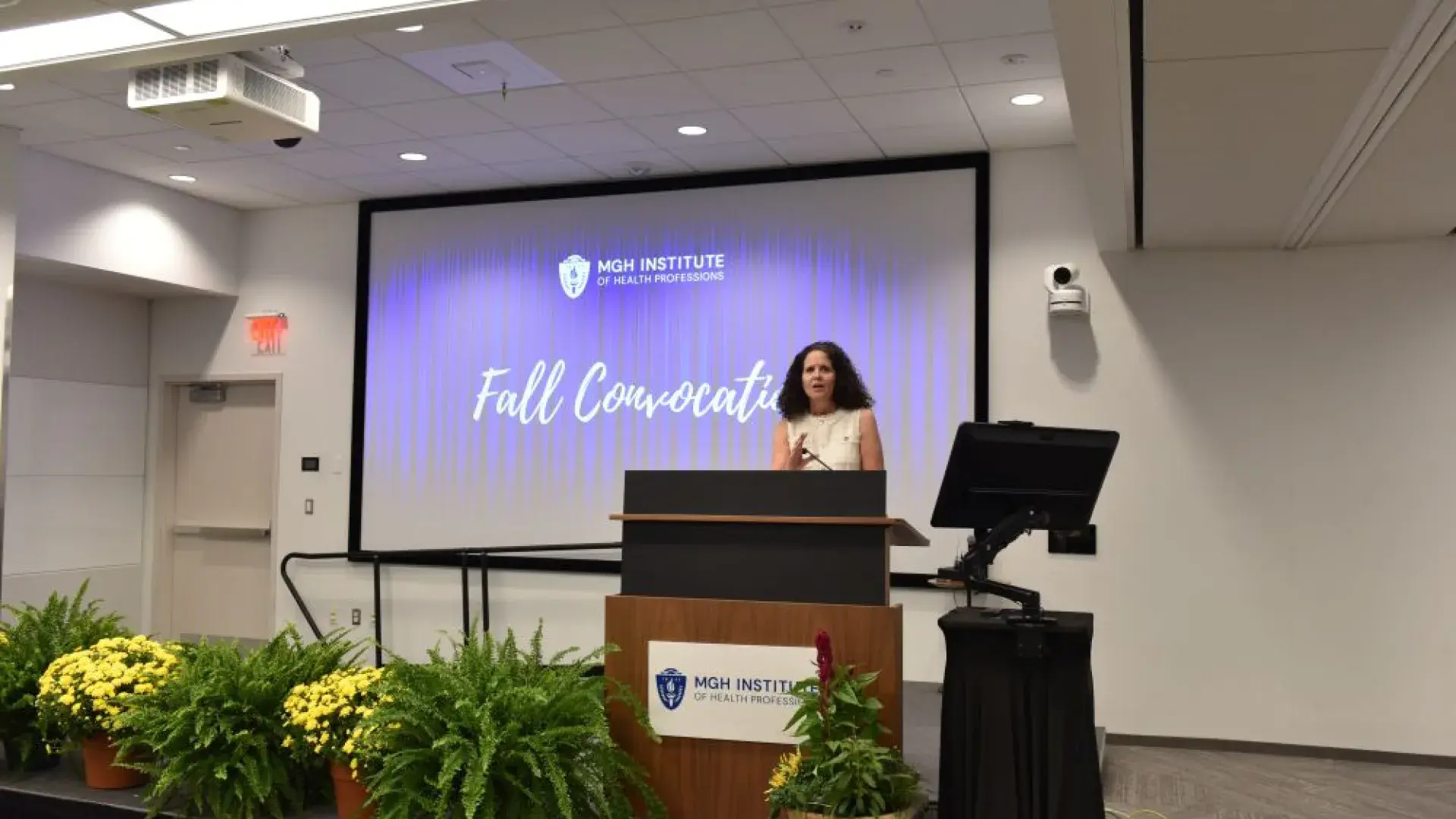 Woman standing at a podium