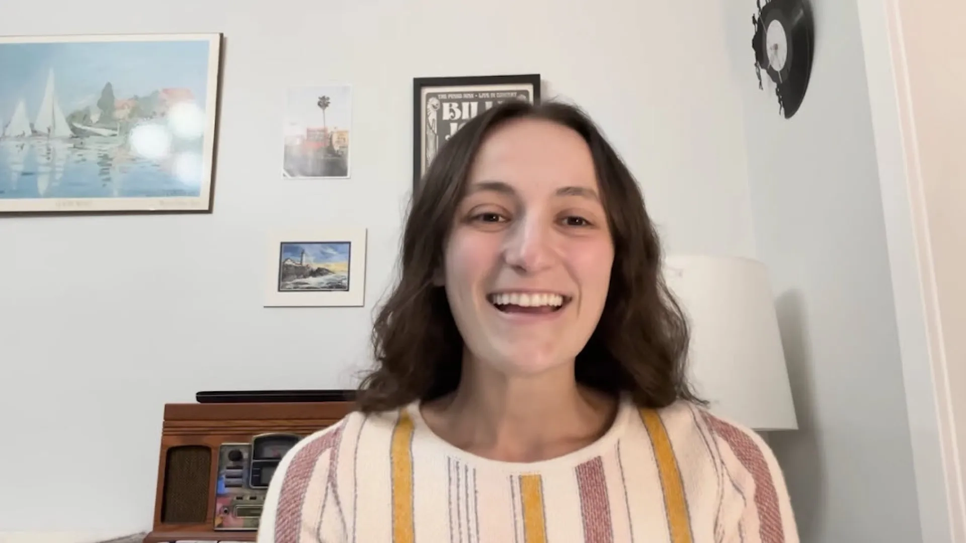 hope smiles as she chats with someone off screen