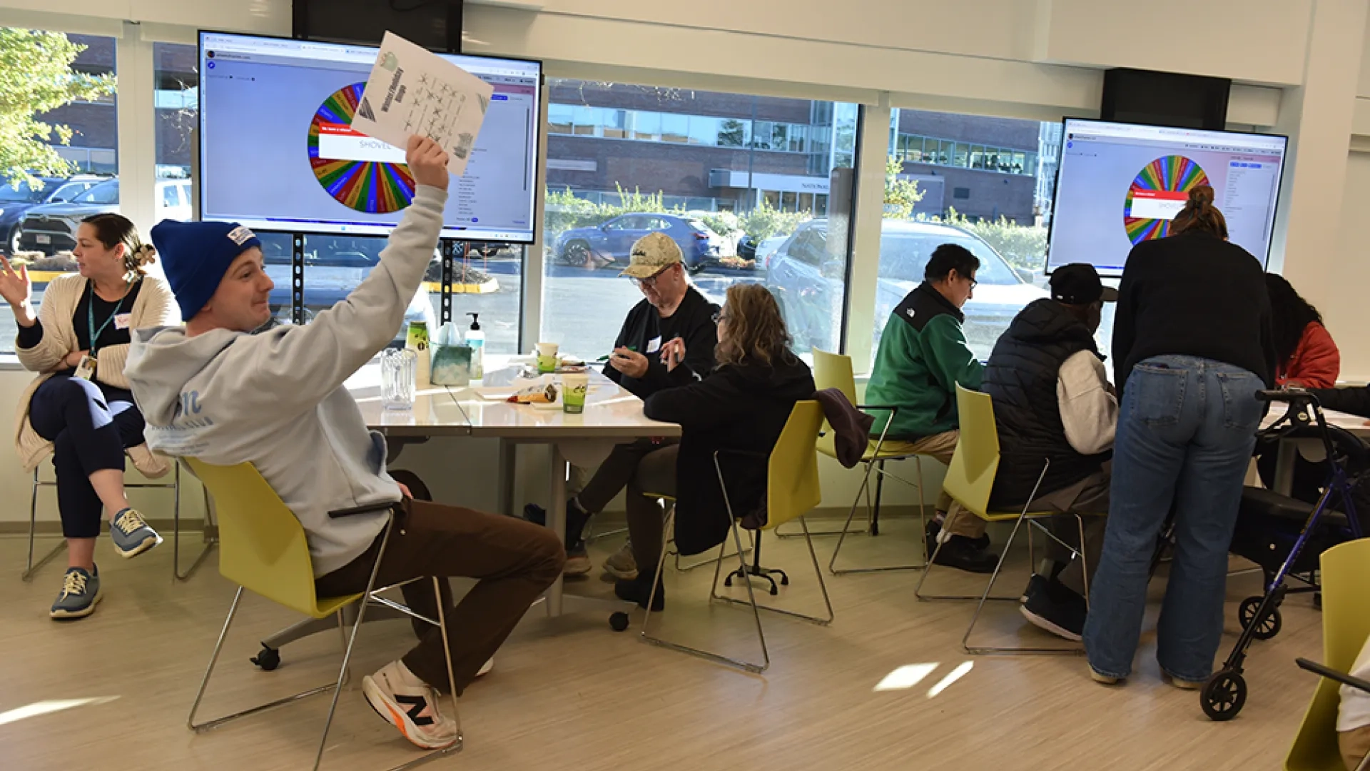 A man holds up a piece of paper