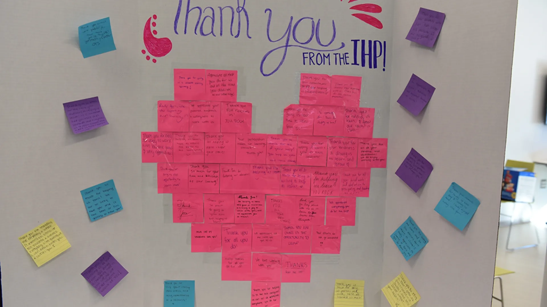 A board with post-it notes forming a heart