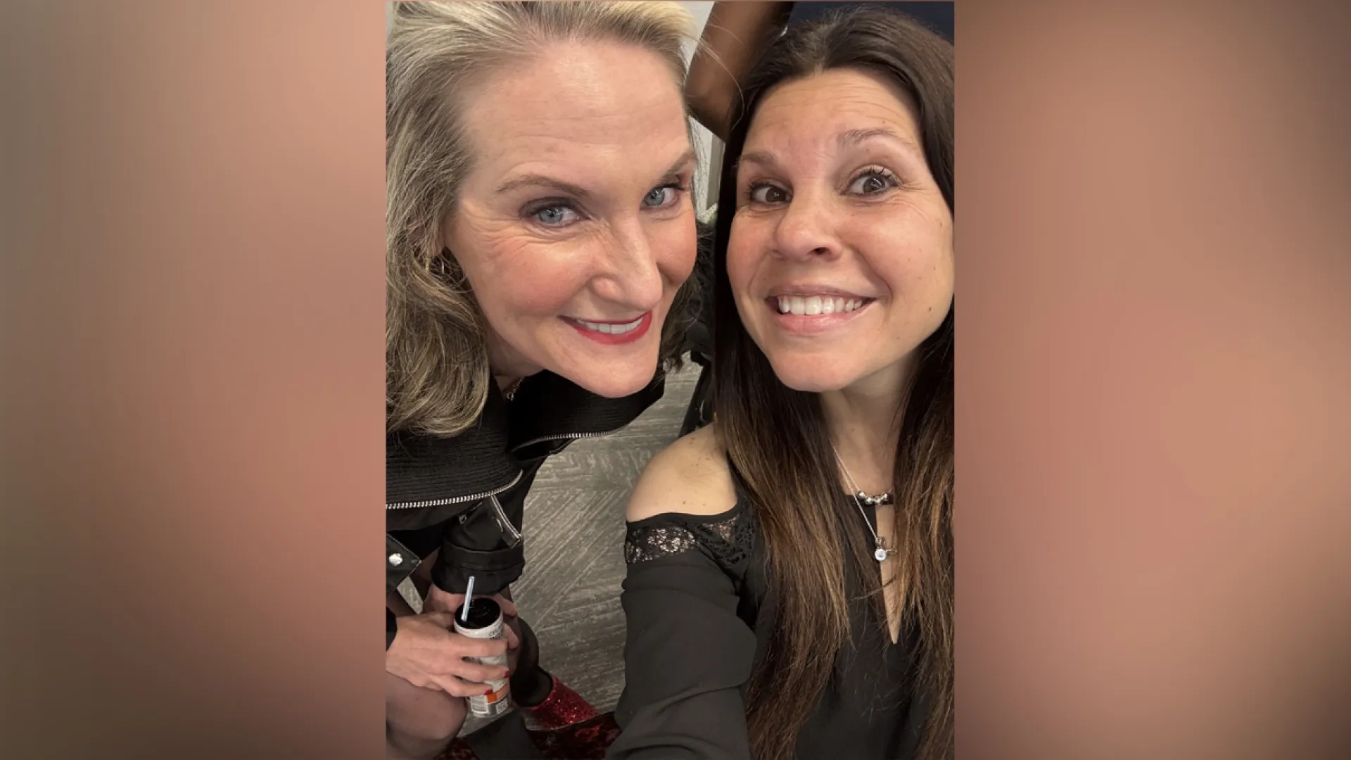 Two women pose for a selfie