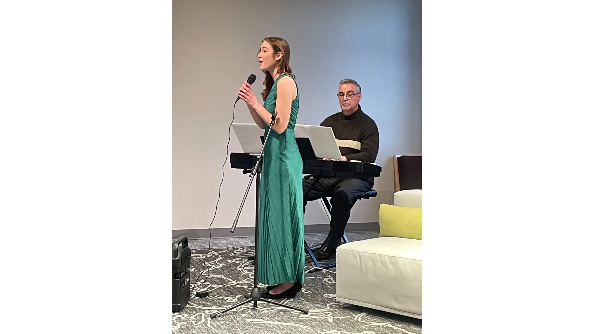 woman singing in green dress