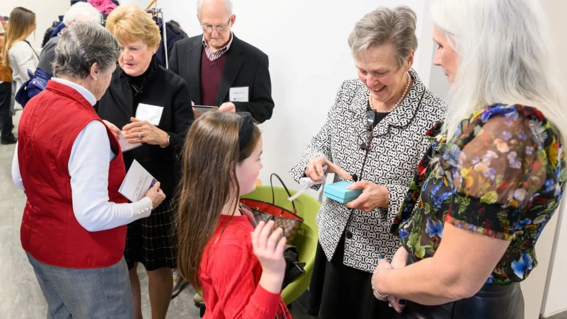 group of people with name tags getting a gift