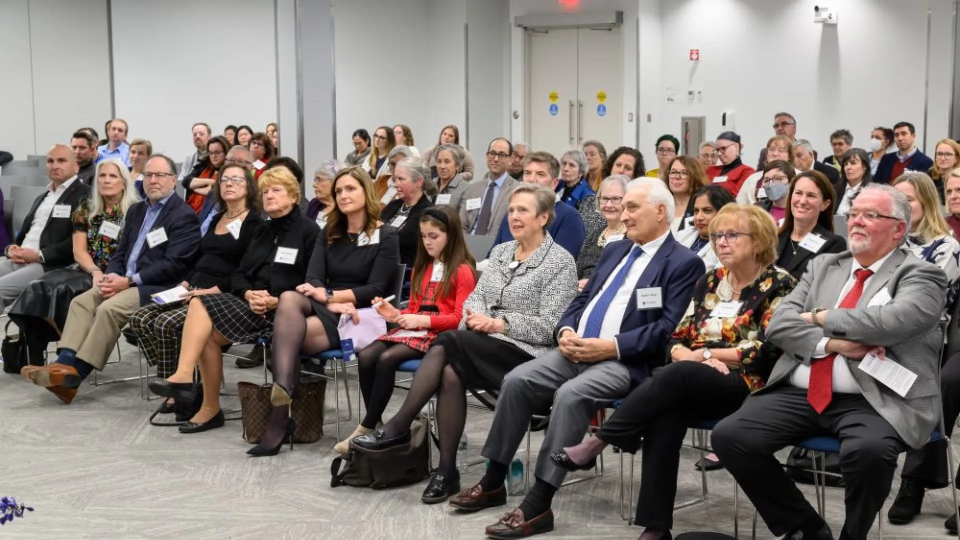 group of people sitting in chairs