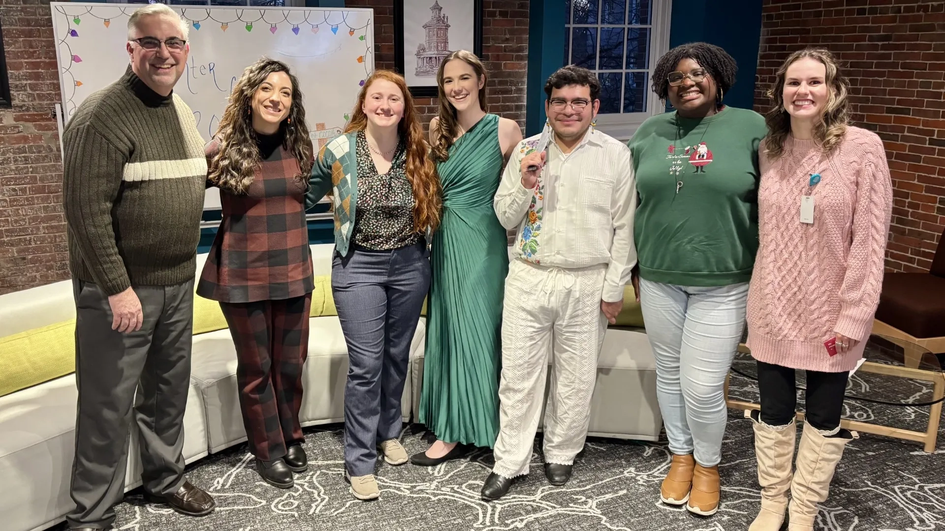 group of men and women smiling