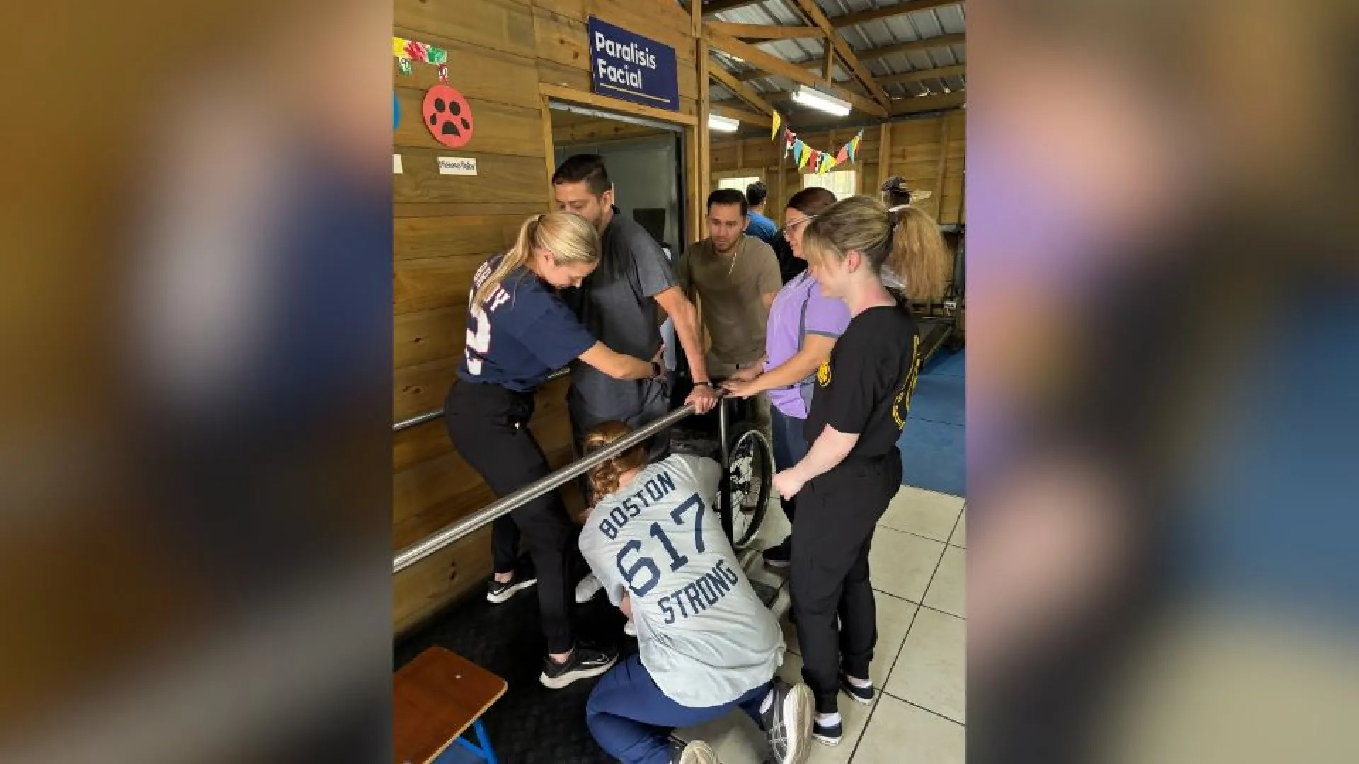 Group of people helping men walk