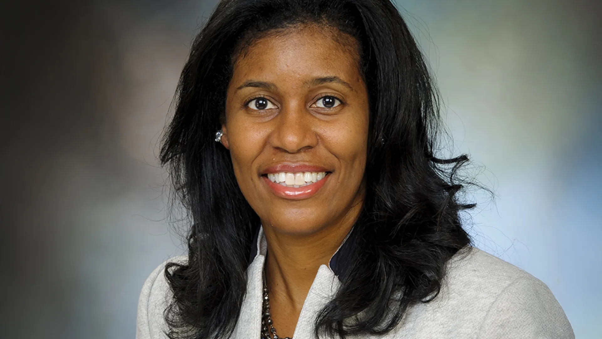 Professional headshot of woman in business attire