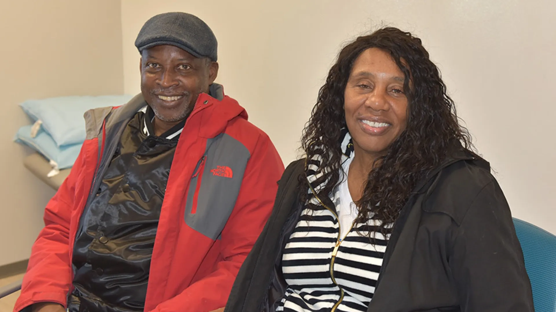 A man and woman sit next to each other