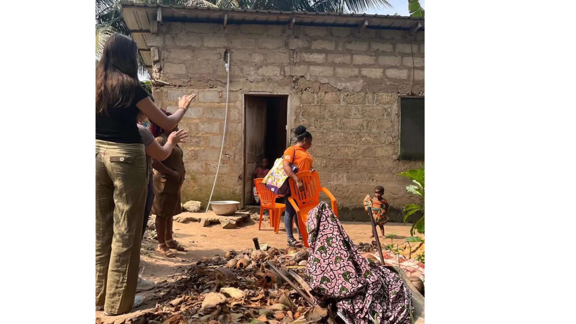 People stand outside a concrete structure 
