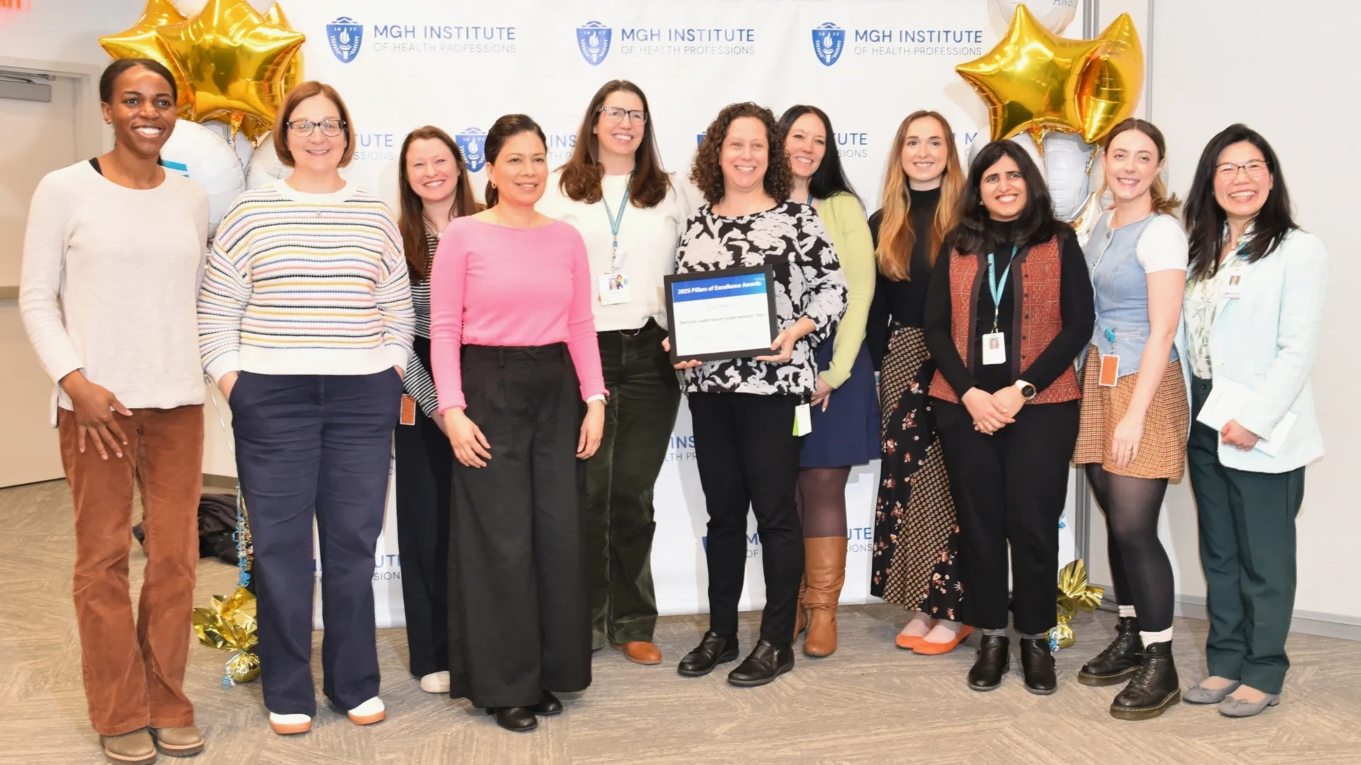 Group of people posing for award photo