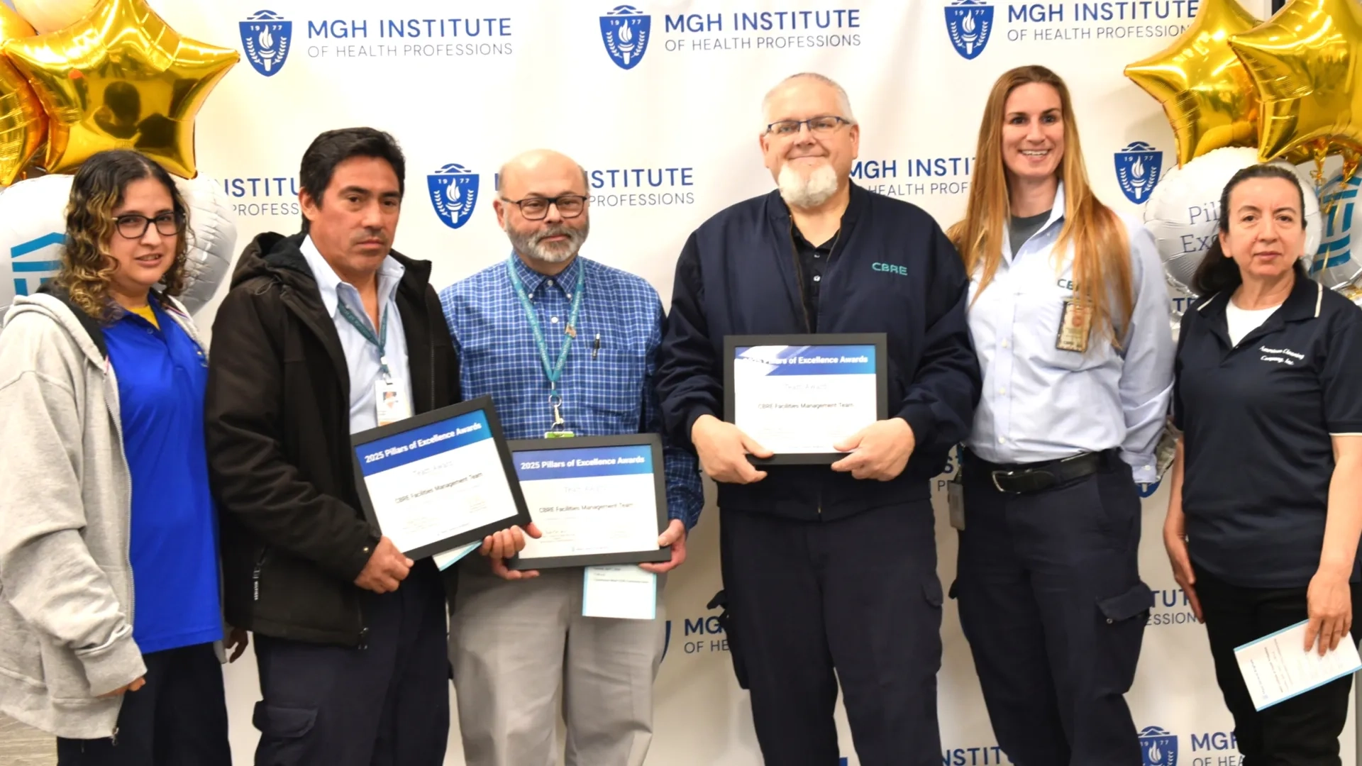 Group of people posing for award photo