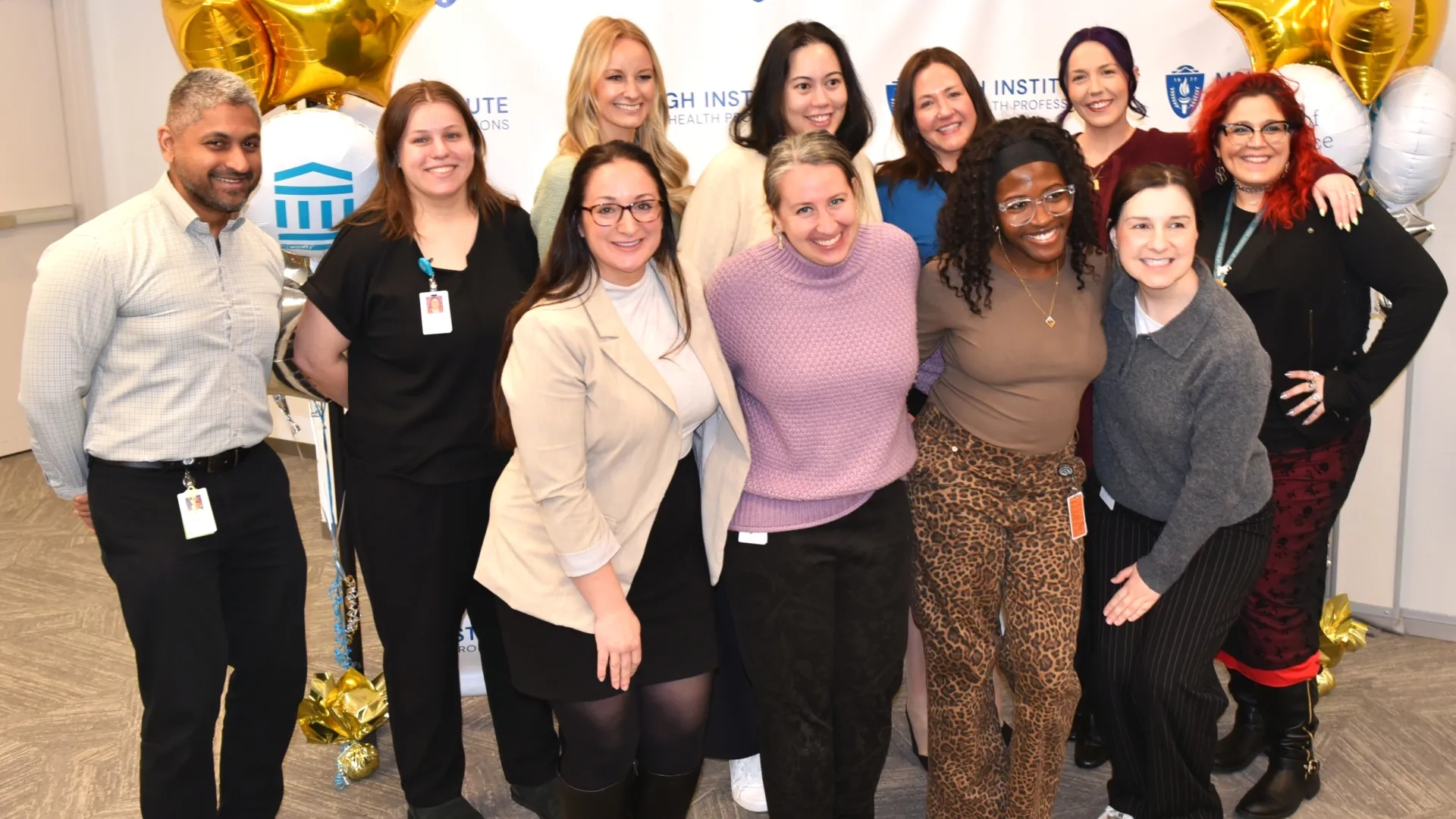 Group of people posing for award photo