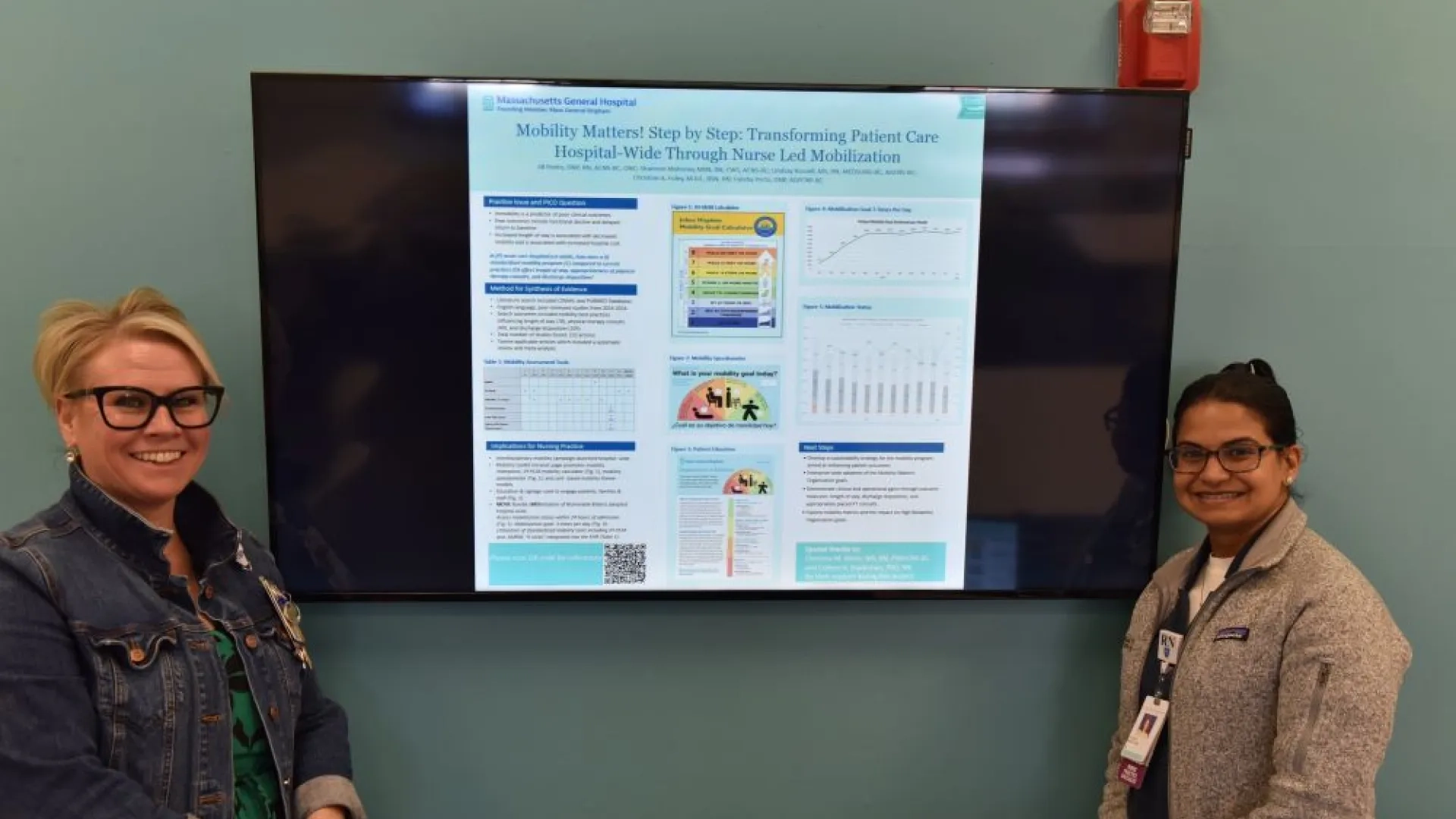 two women in front of a screen