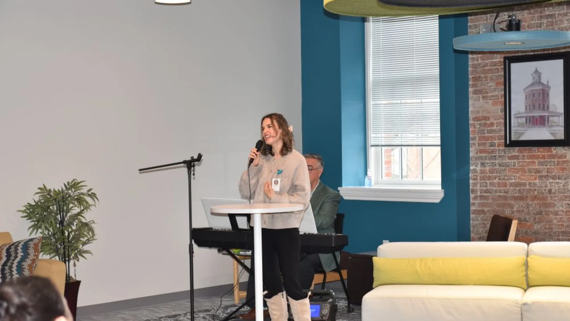 woman singing into microphone