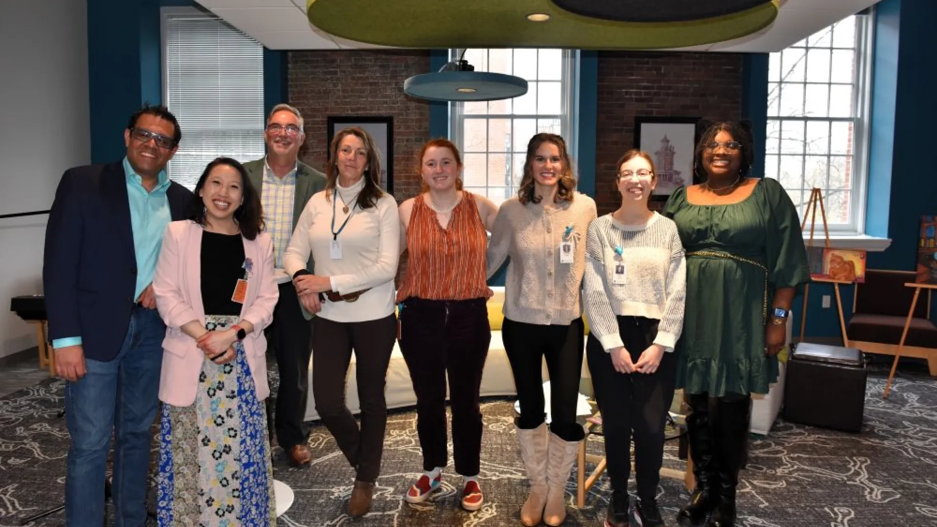 8 people standing together 