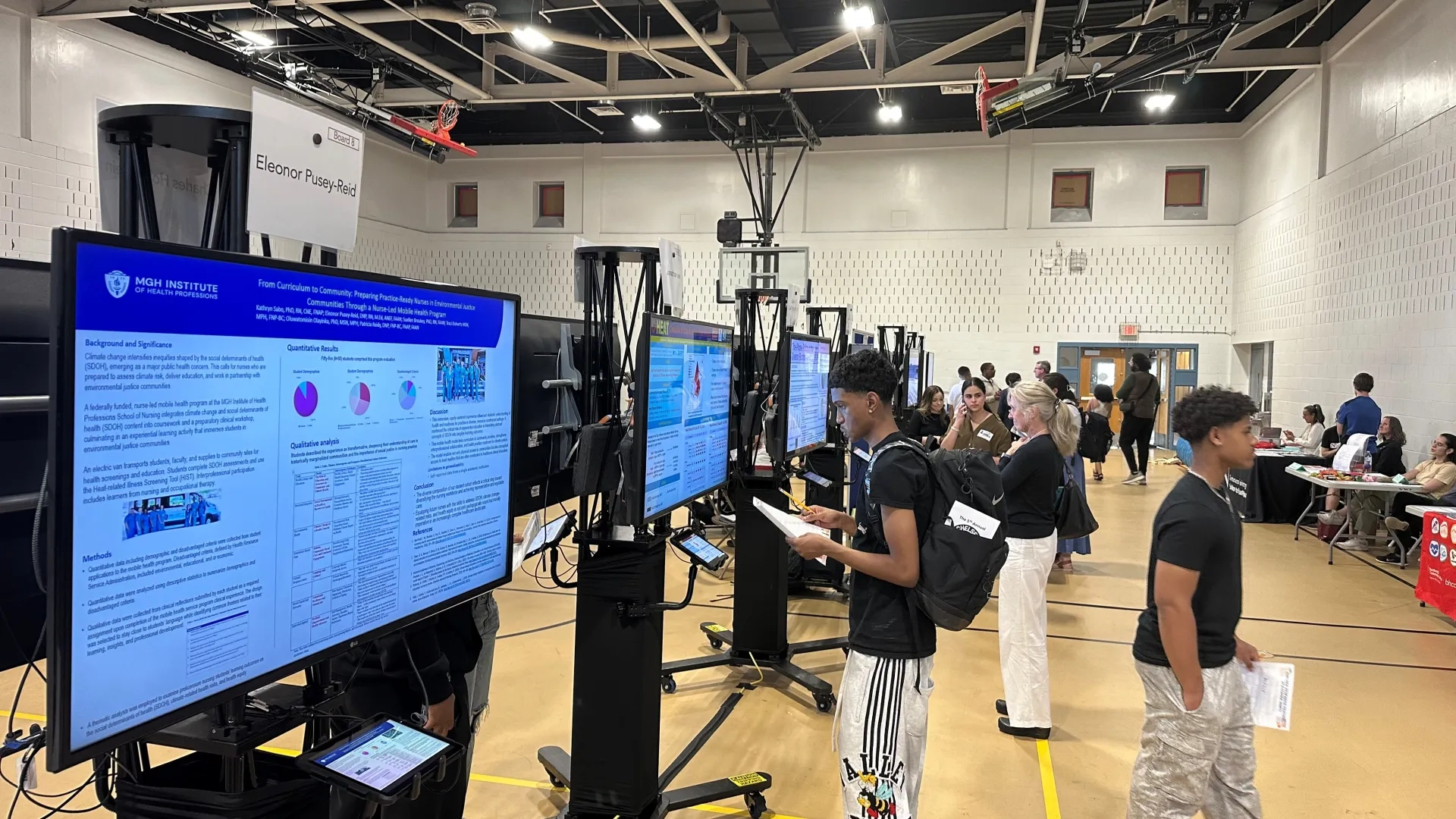 Students looking at research posters 