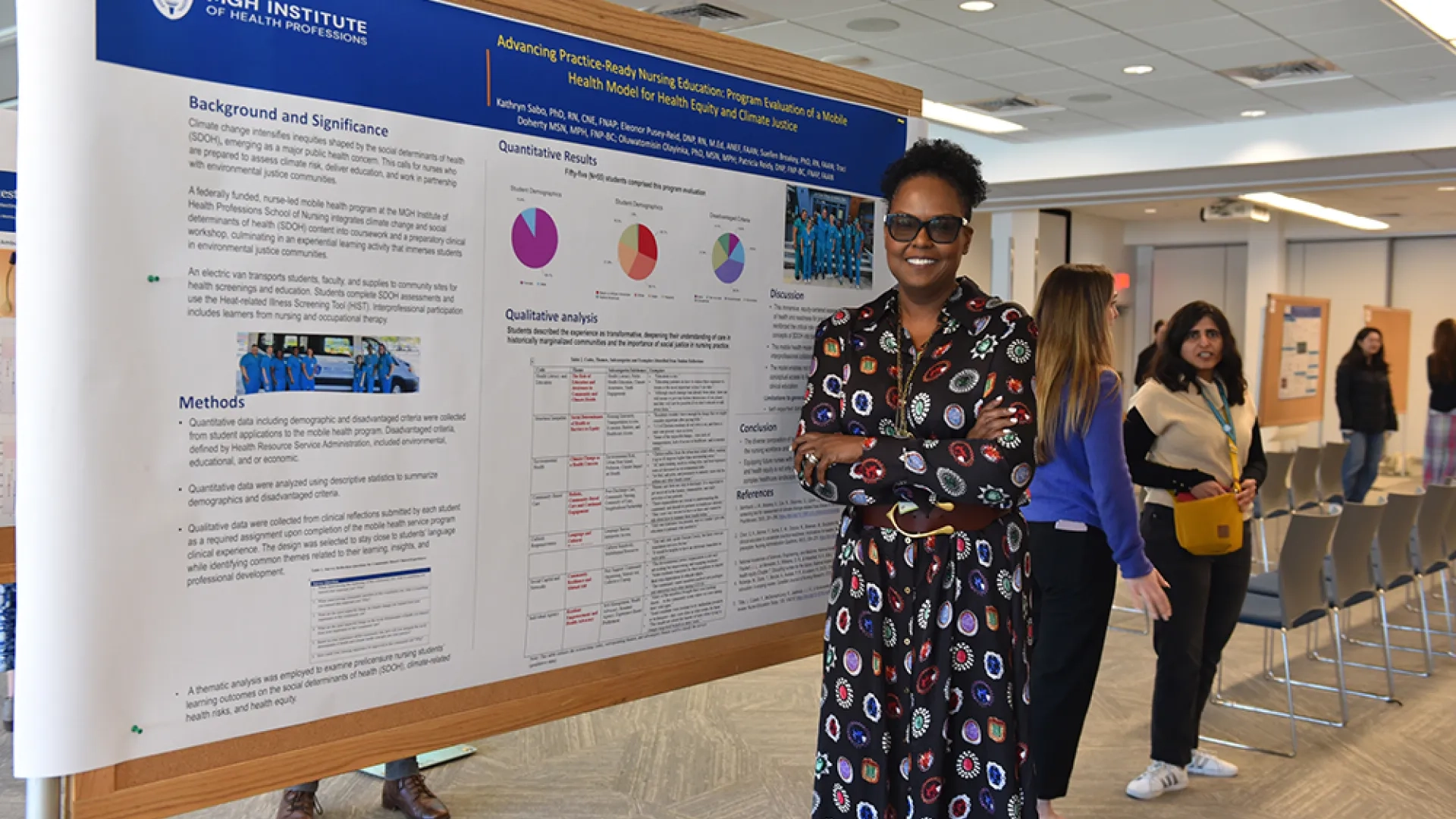 A woman stands at a board with a poster on advancing practice-ready nursing education