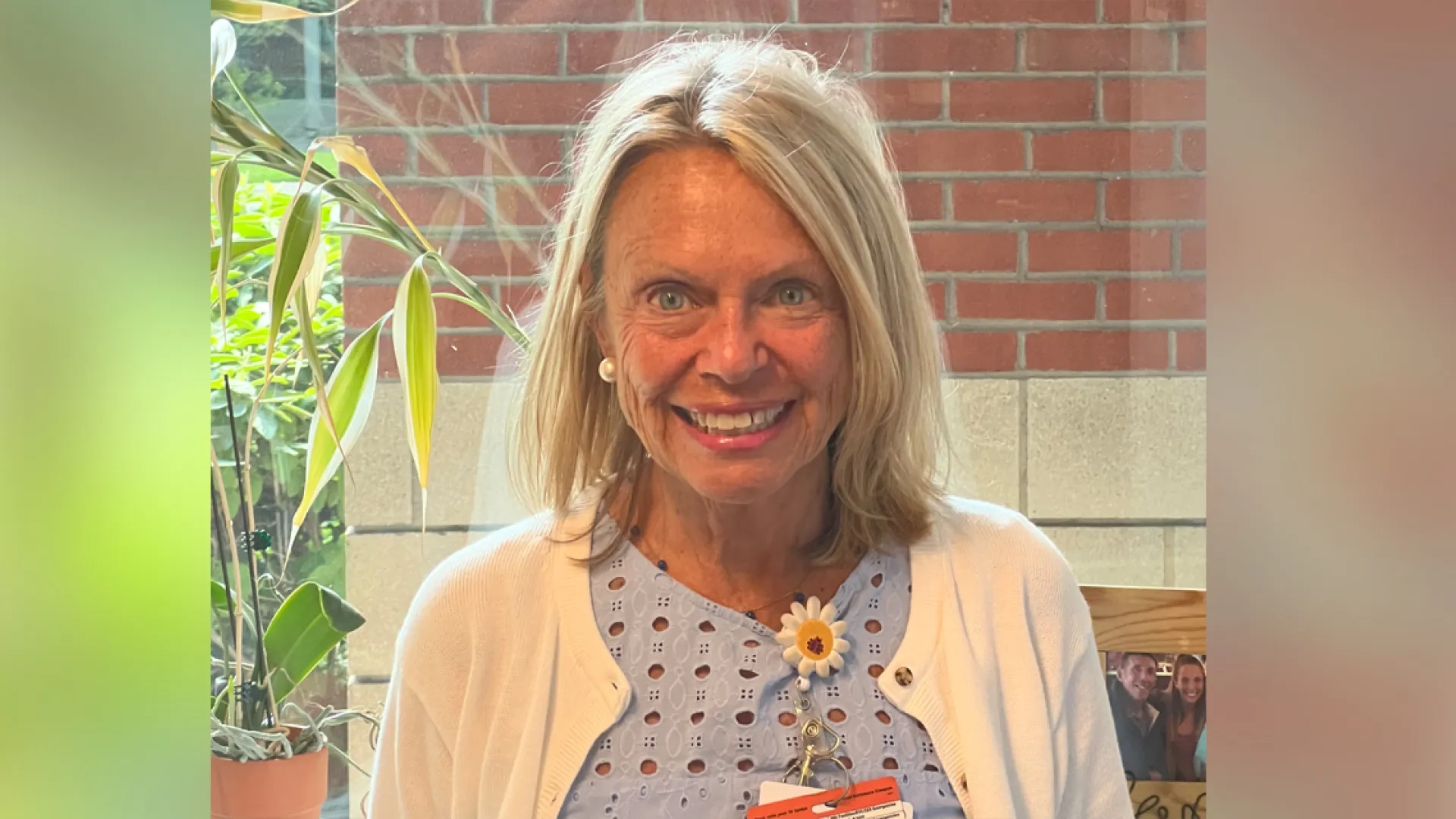 Donna Berizzi stands in front of a brick wall