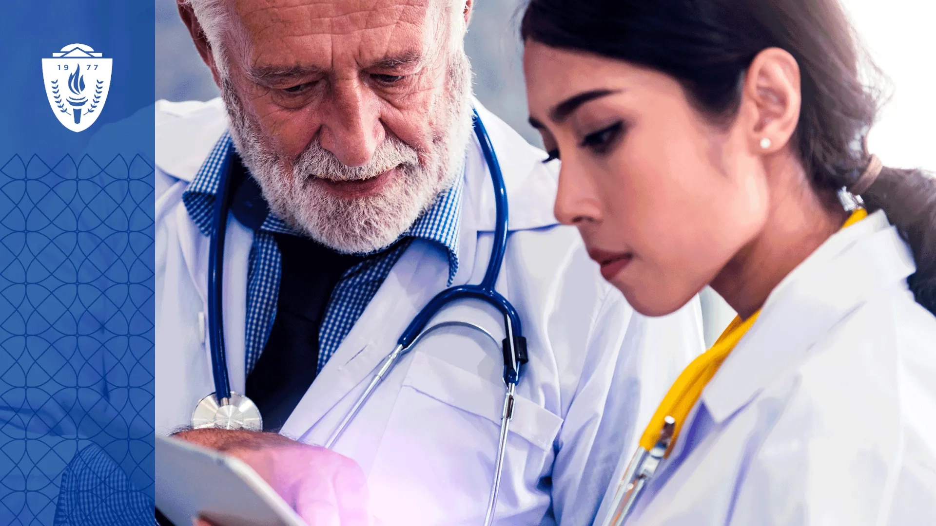 A physician educator works one-on-one with a resident physician while reviewing a digital learning platform on a tablet in a teaching hospital conference room. The image should emphasize coaching, conversation, mentorship, and collaborative learning rather than technology alone. 