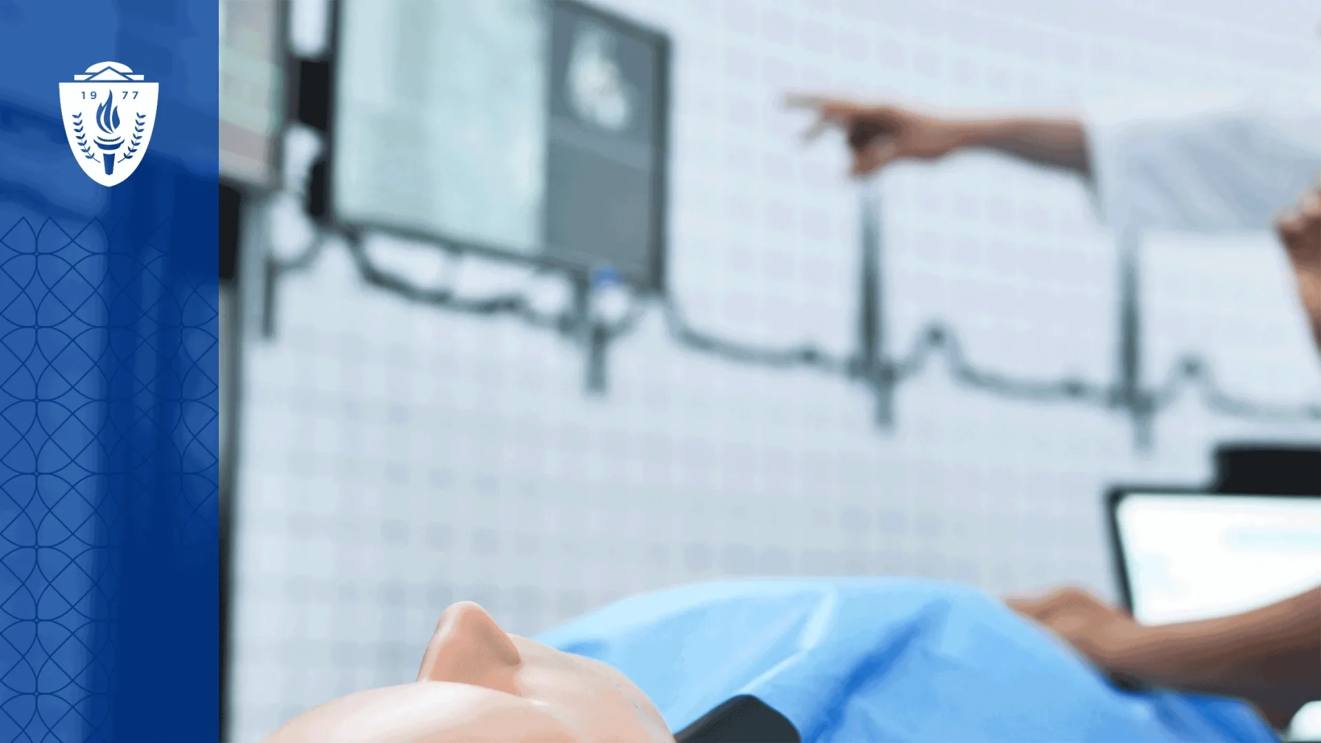 A healthcare simulation mannequin laying on it's back with EKG lines visible on the background