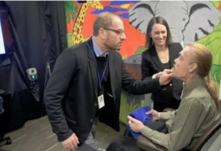Dr. Jordan Green and Dr. Bridget Perry '18 work with a facial transplant patient in the Speech and Feeding Disorders Lab.