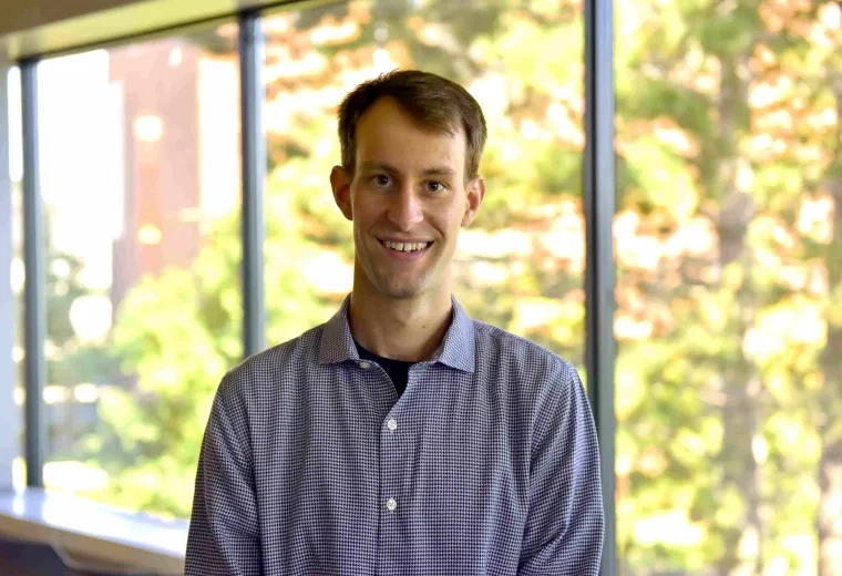 Matthew Picard Fraser  in blue shirt