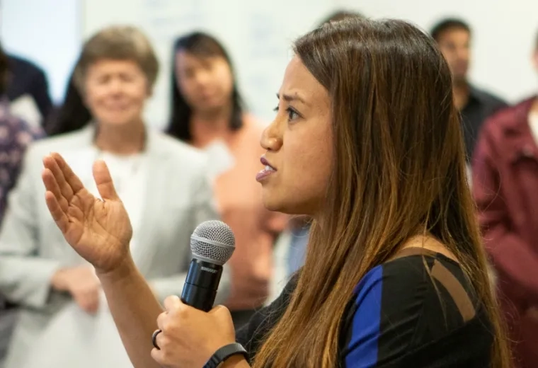 woman speaks in a microphone