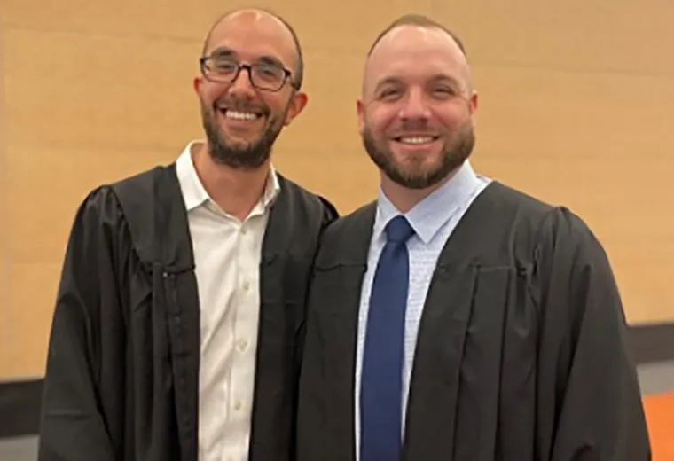 Photo of Master of Science in Nursing graduates Ben Brondsky, left, and Kevin Berney before the start of Commencement 2022.