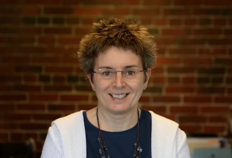 Midge Hobbs in white sweater