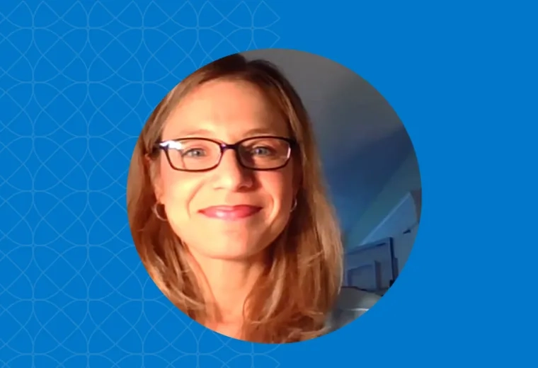 woman's face in the glow of a laptop