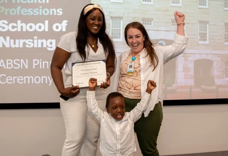 Khadijah Fofanah was honored with the “Quinn Award.” She's pictured celebrating with her son and Dr. Lisa Quinn (right).