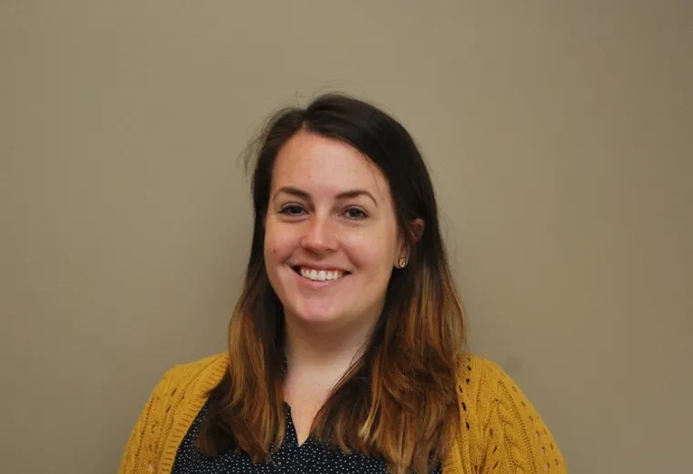 Lisa Quinn in yellow sweater