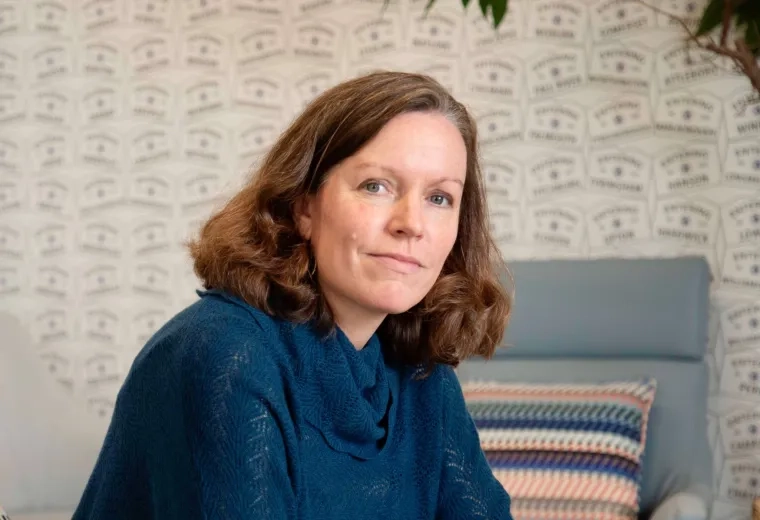 Courtney Hernandez in blue shirt