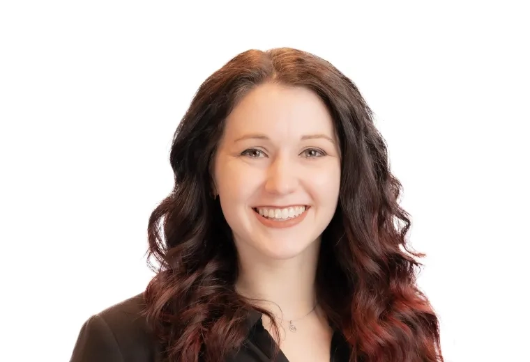 Headshot of a faculty member from the MGH IHP Doctor of Audiology program with a bright background.