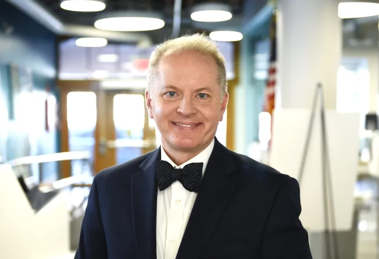 Alex Hoyt in blazer and bowtie