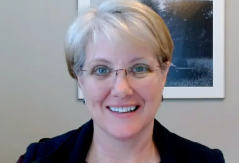 Professional portrait of an MGH IHP Doctor of Audiology faculty member in her office