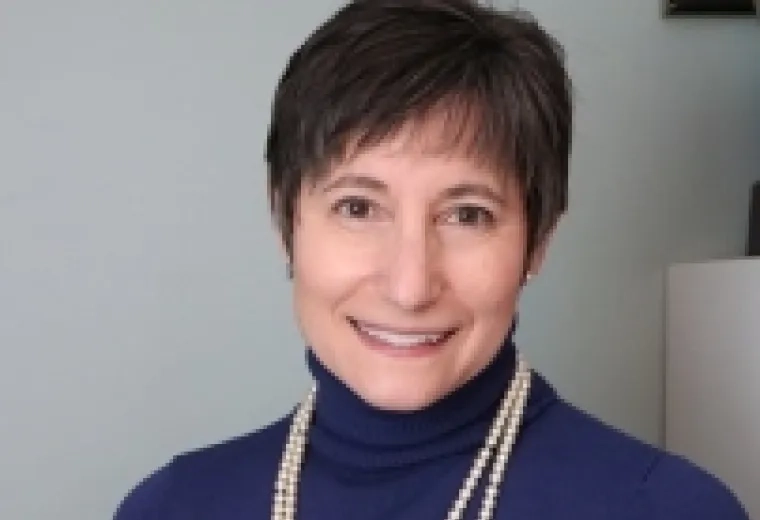 Ruth Palan Lopez in blue turtleneck