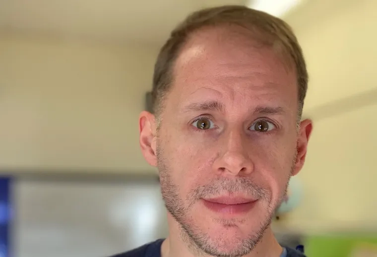 Tom Shull in striped shirt