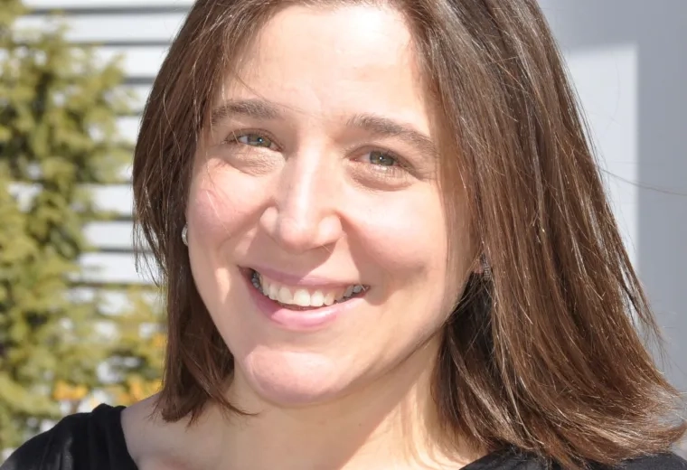 Tara Mansour in black top