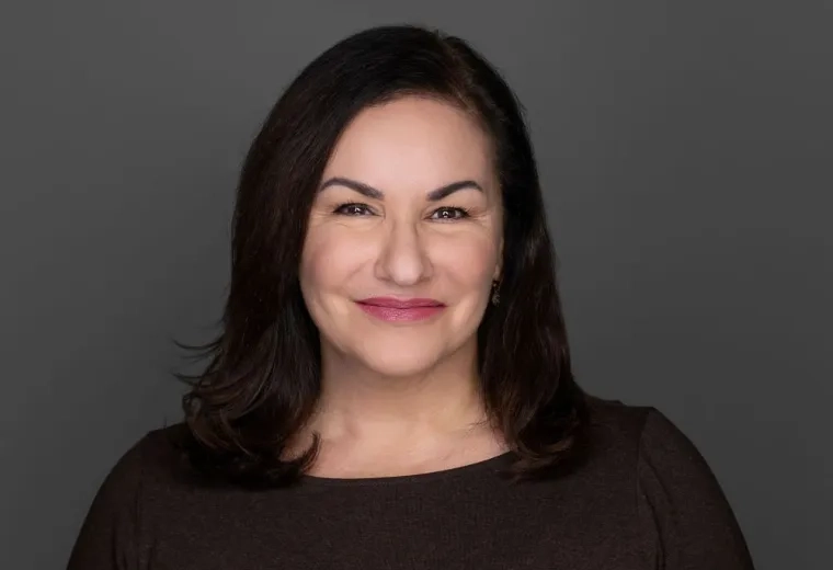 angela has dark brown eyes and hair and raspberry lipstick