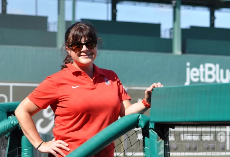 Woman standing in baseball field