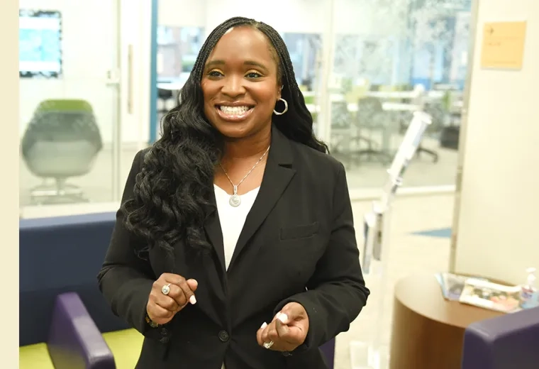 latoya grins and looks off camera