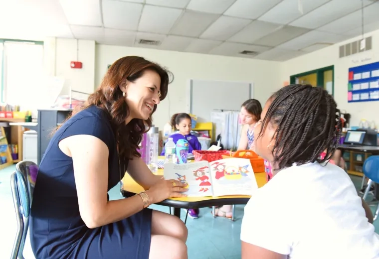 Woman reading to a student