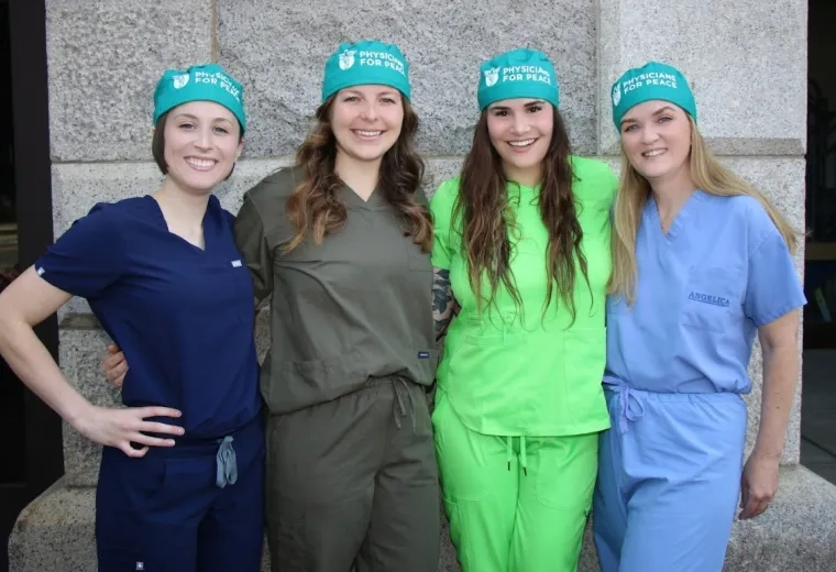 Students and faculty in scrubs