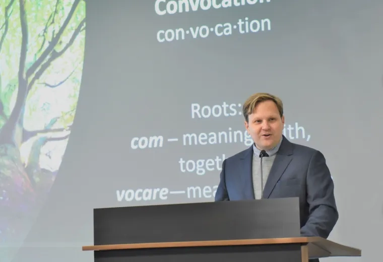 Man speaks at podium