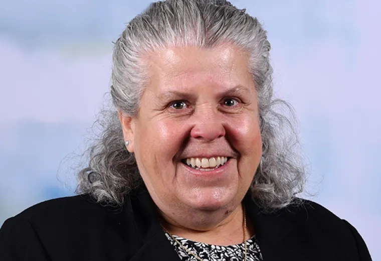 Professional headshot of an MGH IHP Doctor of Physical Therapy program faculty member with a studio background